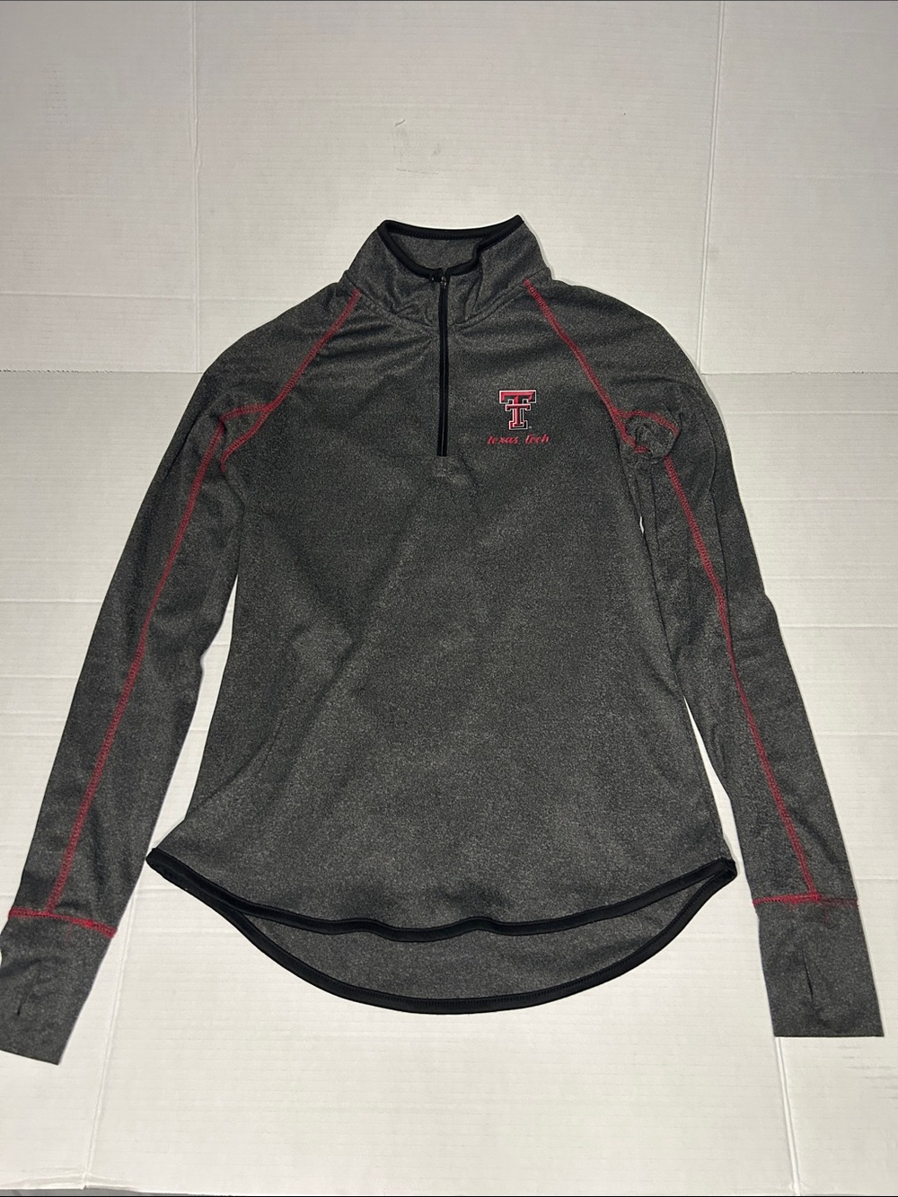 Colosseum women’s Medium Texas Tech 1/4 zip moisture wick top. Thumb holes